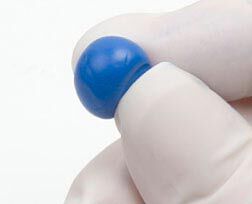 hand holding ball of epoxy